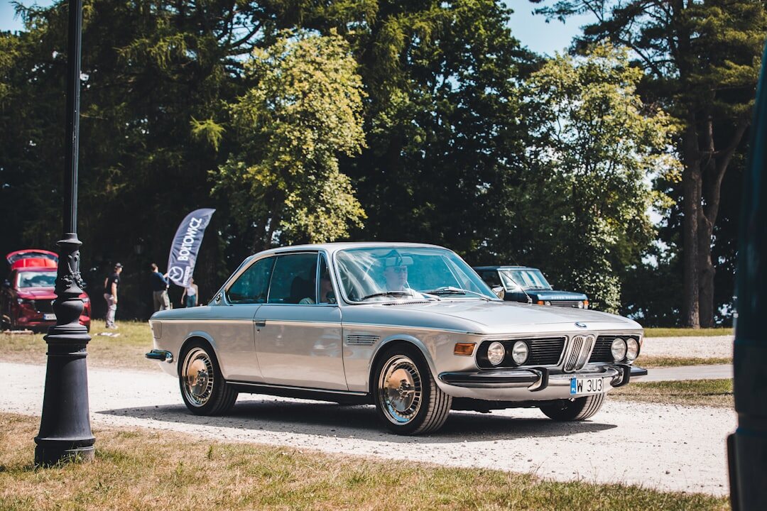 Elegant classic car auction event with an audience and a spotlighted vehicle