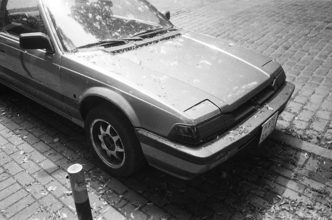 Vintage car parked on a cobblestone street in Colonia del Sacramento